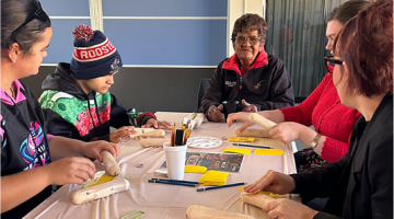 Aunty Francis pictured in the centre, at the Day 1 clap stick workshop.