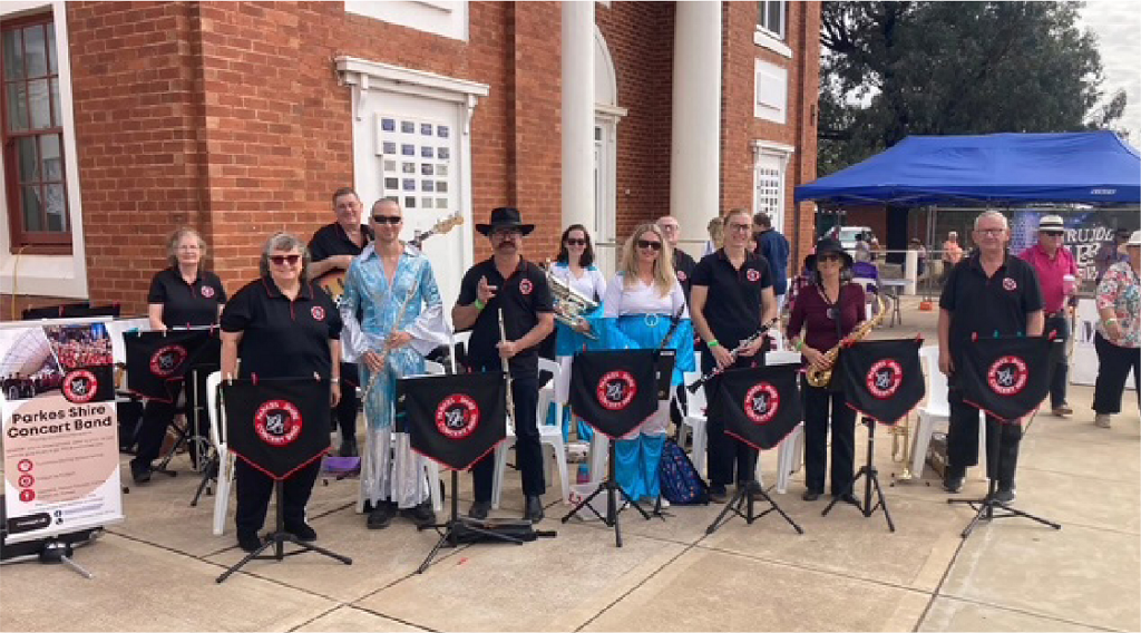 Parkes Shire Concert Band members pictured at the Trundle ABBA Festival with friends from West Wyalong Band dressed in their ABBA costumes..