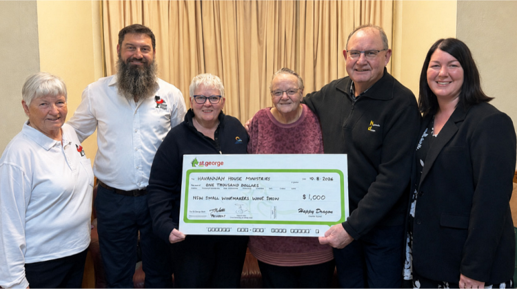 NSW Small Winemakers Wine Show committee members Judy Kerr, Scott Northey, Jenny Watts, Mark Watts and Amy Slessor presenting a $1,000 donation to Pastor Julie Virtue of Havannah House for their annual Christmas lunch.