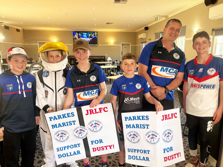 Pictured at the Parkes Coachman Hotel Motel on the far left in a PMJRL guernsey is Dusty Langby, alongside PMJRL junior players and Club President Parkes Jason O’Brien. Right: Dusty pictured meeting Australian Prime Minister Anthony Albenese upon his arrival to Parliament House Canberra.