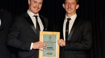 Cameron Standen and Riley Thomson proudly pictured with their award